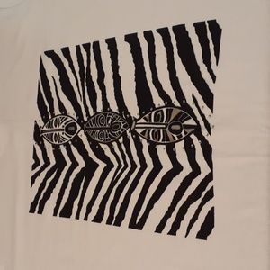 Joni b. White t-shirt with zebra striping and 3 faces or masks on front   size l